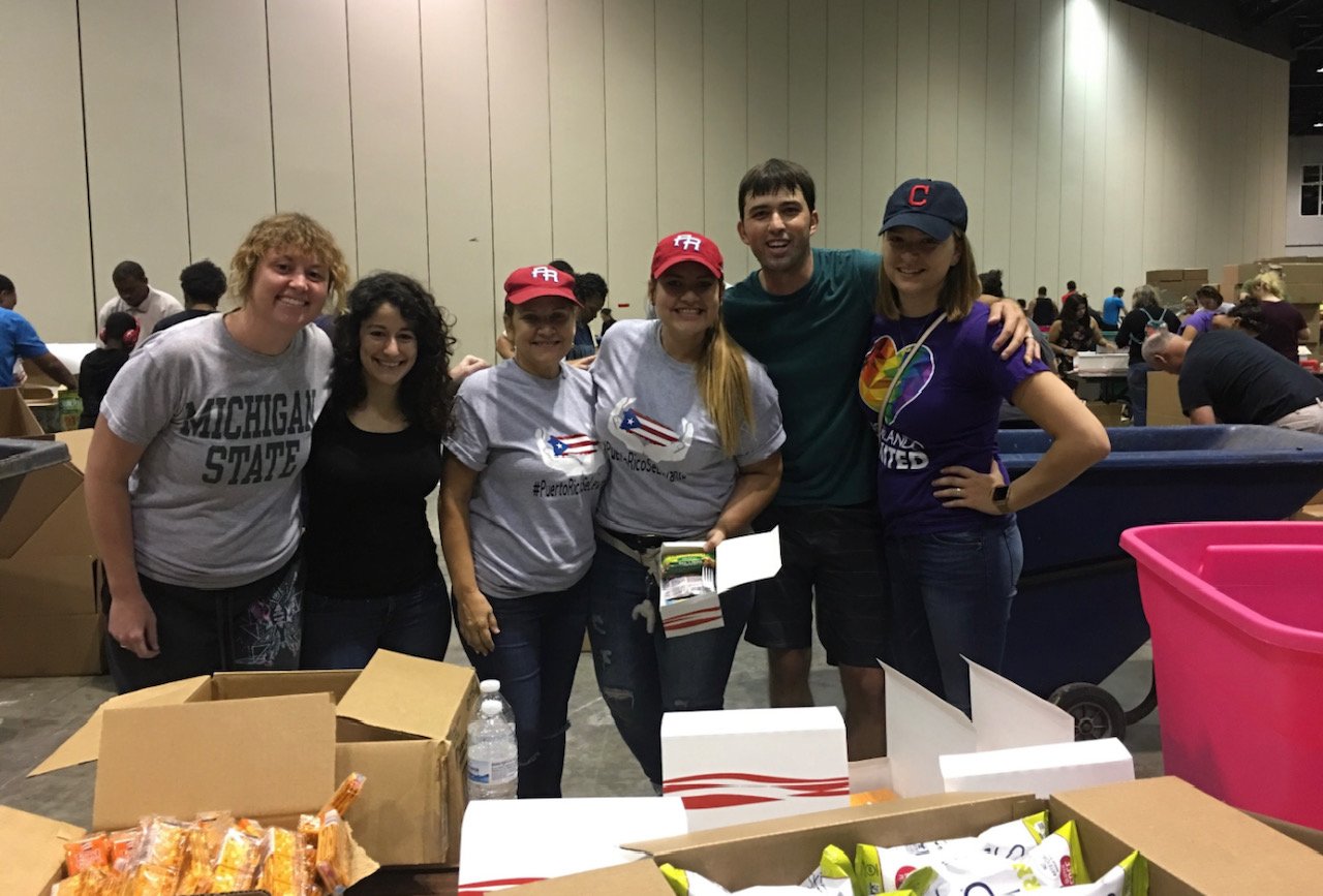 The author, Jennifer A. Marcial Ocasio, her mother (center), and her Orlando Sentinel colleagues at an event for Feeding Children Everywhere in Orlando after Hurricane Maria hit.