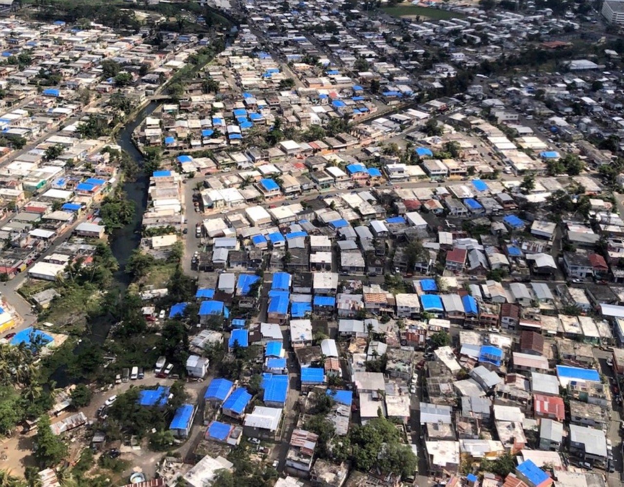 Arial view of Puerto Rico in May 2018. Many houses were still covered in blue tarps eight months after Hurricane Maria hit.