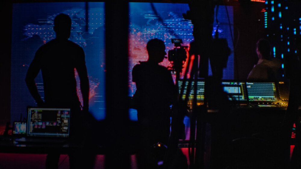 Silhouette of filmmakers working in a studio
